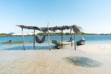 Boats and net in the lagoon, Lençois Maranhenses, Brazil 