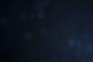 A dark blue background bokeh image for used to decorate background.