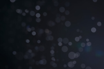 A dark blue background bokeh image for used to decorate background.
