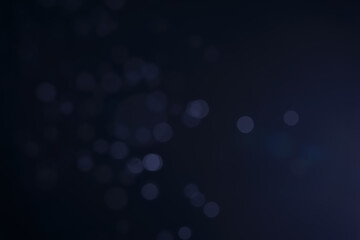 A dark blue background bokeh image for used to decorate background.