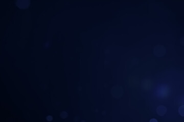 A dark blue background bokeh image for used to decorate background.