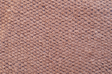 Close up of fabric texture in pink brown colors. Colorful wool yarn cloth background. 