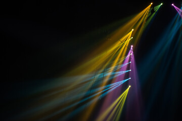 Colorful stage spotlights with laser radiation