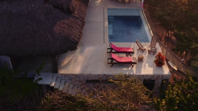 Slow drone forward towards luxury rental villa with pool in Oaxaca mexico Pacific Ocean 4k aerial