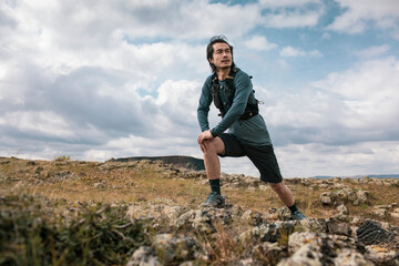 Male trail runner training in nature