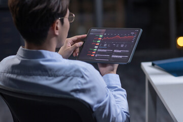 Businessman working in office at night