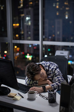 IT worker working in office at night