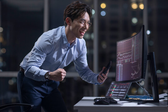 Businessman working in office at night