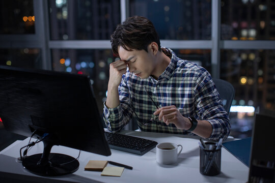 IT worker working in office at night