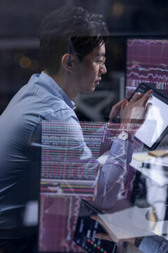 Businessman working in office at night