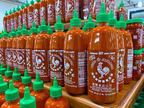Los Angeles, CA,,USA October 21st 2021 Plastic bottles of Huy Fong Food Sriracha hot chili sauce for sale in a supermarket aisle