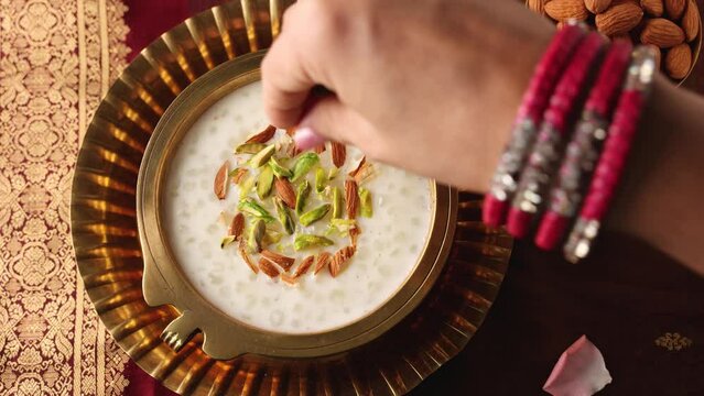 Sabudana Kheer thick pudding with tapioca pearls sago dessert from cassava root Indian sweet mithai chowari payasam for Mahashivratri Ram Navami Diwali festival 4k video footage