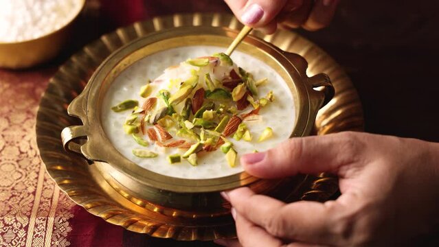 Sabudana Kheer thick pudding with tapioca pearls sago dessert from cassava root Indian sweet mithai chowari payasam for Mahashivratri Ram Navami Diwali festival 4k video footage