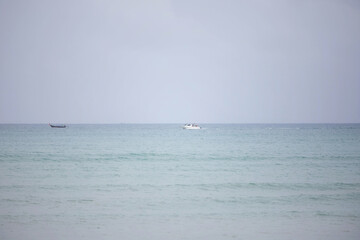 Speed boat and longtail boat in th tropical sea