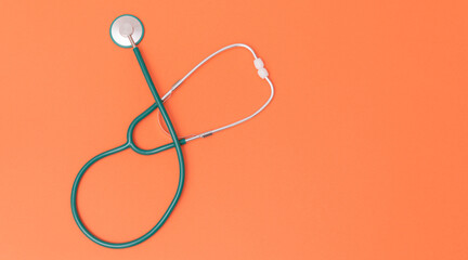 Medical stethoscope on color background with place for text. Abstract medical background