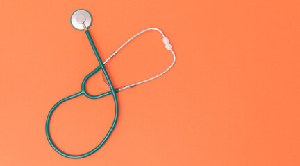 Medical stethoscope on color background with place for text. Abstract medical background