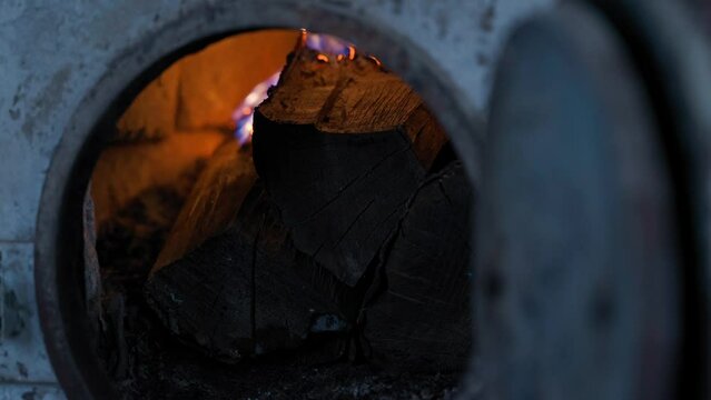 Atmospherically burning fire in the firebox close-up. Burning wood in winter