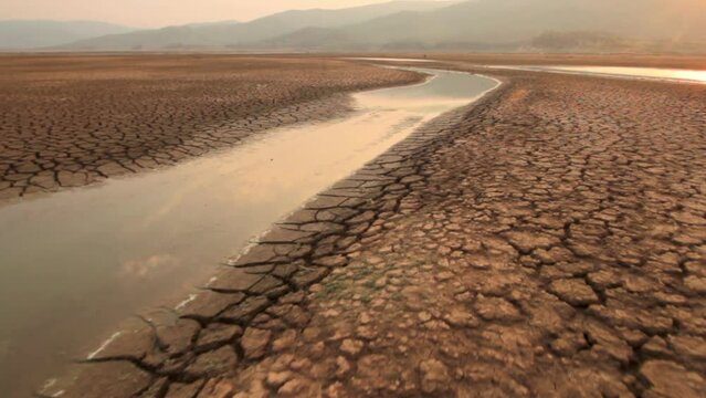 Climate change and river source, Landscape Drought impact river drying with dry cracked earth. Global warming and Water crisis concept.