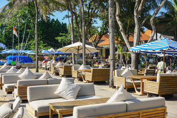 Sanur, Bali (October 23, 2022): Sanur beachfront is filled with lounge chairs and sunbed