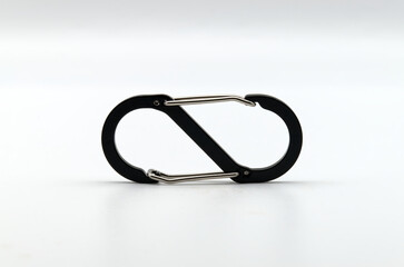 Fototapeta premium Black and silver carabiner isolated on white background