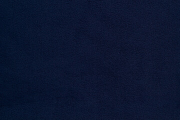 Fleece fabric blue top view. Texture of textile fleece bedspread.