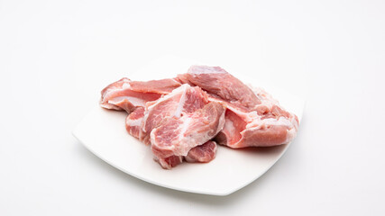 Raw soft pork ribs isolated on plate .White background.
