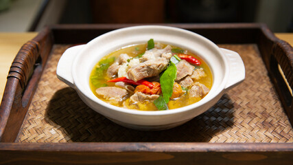 Spicy spare rib pork  ,Fiery Pork Ribs Broth in white bowl.asian food