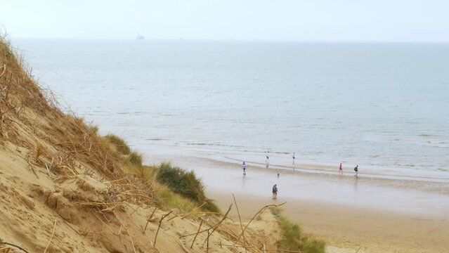 Formby beach, Merseyside coastline beach a ship sails on the horizon