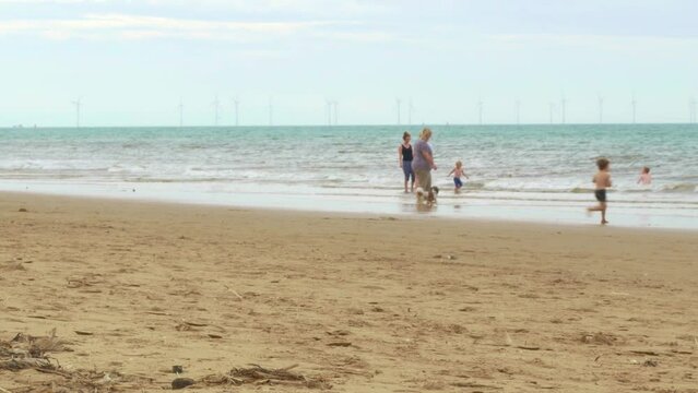 Formby beach British seaside beach with windfarm on horizon 1