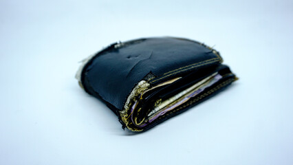 Close up image of torn wallet on white background.