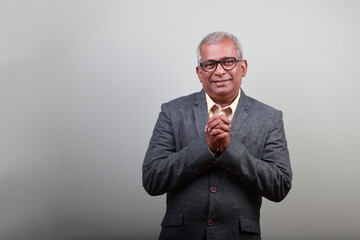 Portrait of a senior man of Indian ethnicity with a smiling face