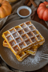 autumn breakfast with pumpkin waffles on table