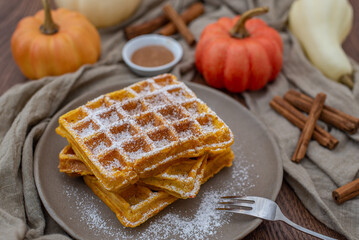 autumn breakfast with pumpkin waffles on table