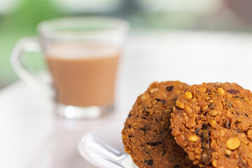Indian Snack Peas Masal Vada, deep fried snacks food with cup of tea.