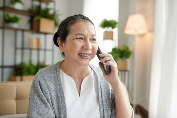 Fototapeta premium Aged Woman Talking on Phone