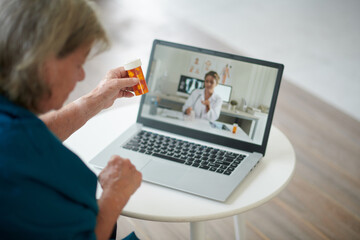 Fototapeta na wymiar Elderly Woman Video Calling Doctor