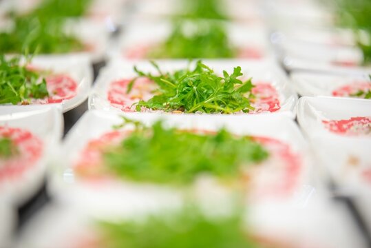 Selective focus of salad plates on a tabale