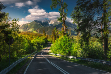 A road towards Tatra Mountains on summer.  Droga do Tatr w kierunku na Morskie Oko, lato. Panorama polskich gór, na podhalu, w okolicach Polany Głodówka. 