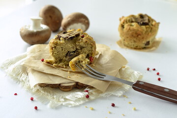 Muffin with mushrooms and cheese on cornmeal, snack muffin