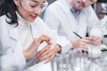 pharmaceutical science laboratory of health care cosmetic research, apothecary scientist working to...