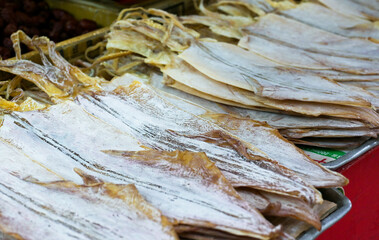 dried squids on shelf in the fresh market selective focus