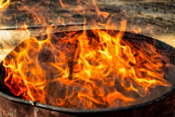 Burning fire in a barrel close-up. Bright flame. Open flame heating. Problems with heating and gas.
