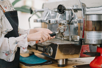 Opening a small business, AHappy Asian woman in an apron standing near a bar counter coffee shop, Small business owner, restaurant, barista, cafe, Online, SME, entrepreneur, and seller concept