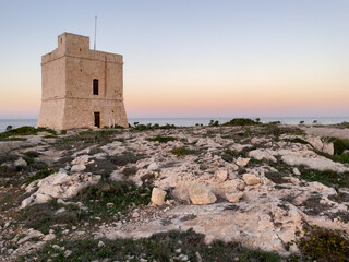 Fototapeta na wymiar Naxxar, Malta - October 24th 2022: Saint Mark's Tower on the shore of the Mediterranean Sea was completed in 1658 and is the third of the De Redin towers to be built by the Order of Saint John.