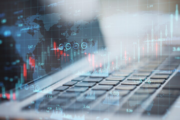 Global business and stock market concept with digital financial chart indicators and world map on modern laptop background, double exposure