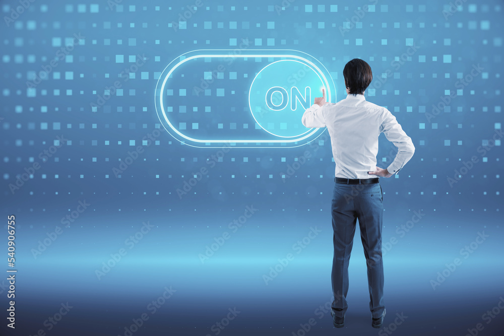 Poster back view of young european businessman with glowing on slider button hologram on blue background. t