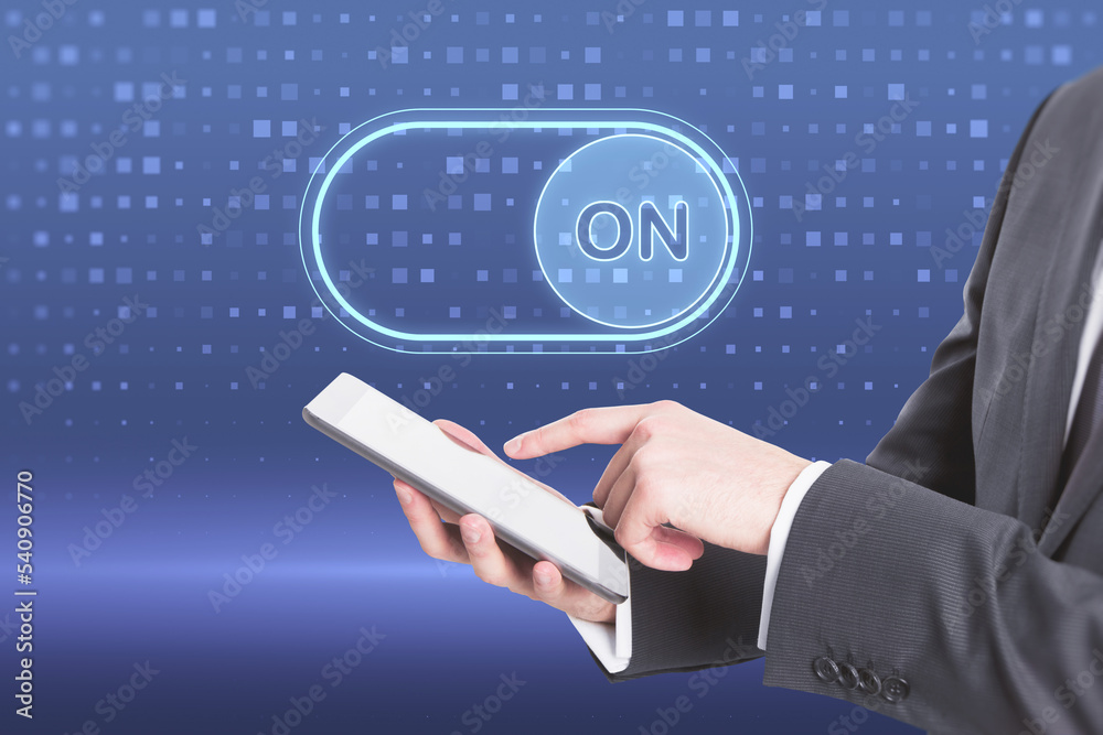 Poster close up of businessman hand with cellphone and glowing on slider button hologram on blue background