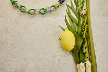 Jewish festival of Sukkot. Traditional symbols Etrog and lulav - citrus and palm. © vetre
