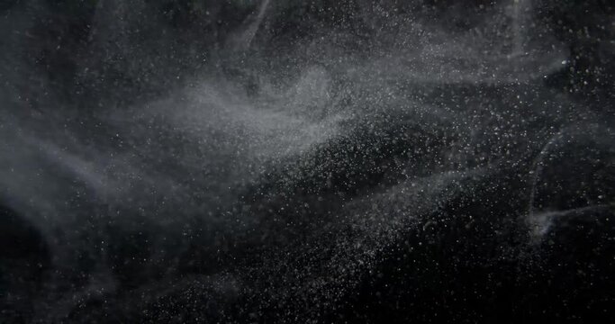 Natural Organic Gold Dust Particles System Floating On Black Screen. Slow motion Background. RED camera.