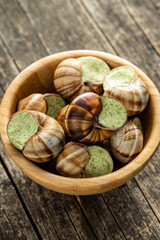 Snails with parsley butter, Bourgogne Escargot Snails in bowl. Delikatese food.